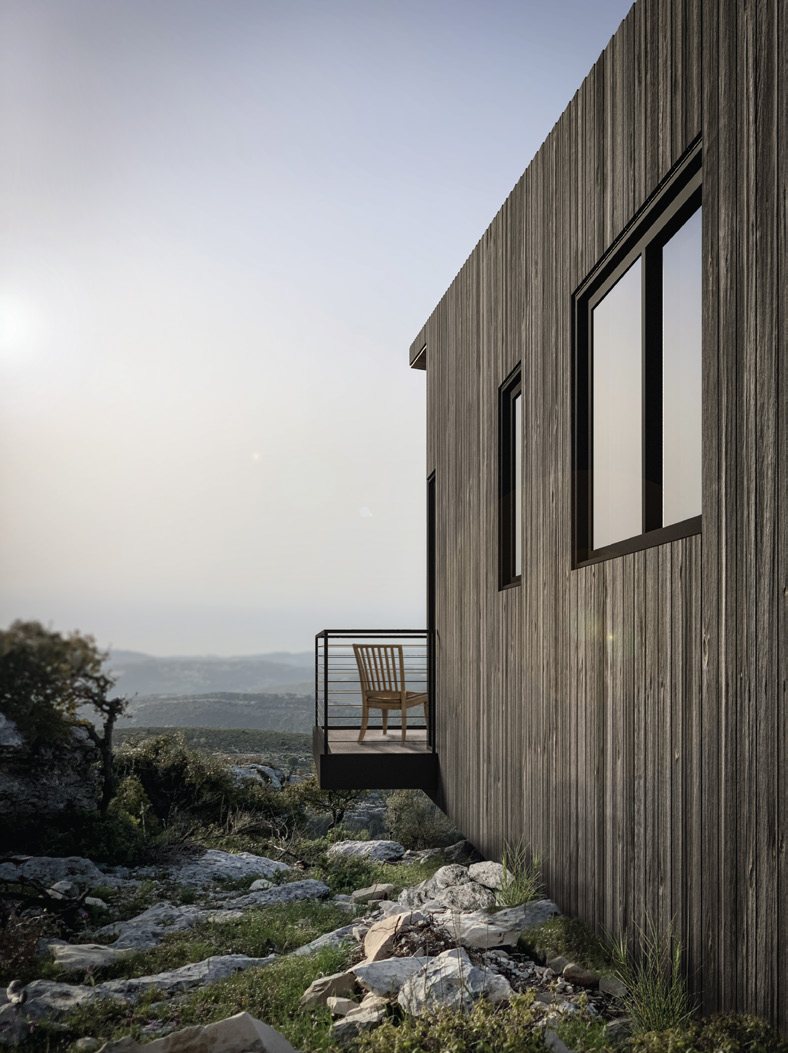 Cabin cantilevered over rock outcrop